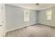 This bedroom features natural light from two windows and neutral carpeting at 2569 Northview Ave, Decatur, GA 30032
