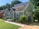 Gray brick home featuring a unique blue door and landscaped front yard at 2569 Northview Ave, Decatur, GA 30032