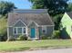 Gray brick home featuring a unique blue door and well-maintained front yard at 2569 Northview Ave, Decatur, GA 30032