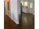 Hallway with hardwood floors that opens to a modern kitchen at 2569 Northview Ave, Decatur, GA 30032