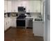 Bright kitchen with stainless steel appliances, white cabinets, and sleek countertops at 2569 Northview Ave, Decatur, GA 30032
