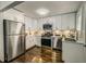 Modern kitchen with stainless steel appliances, white cabinets, and hardwood floors at 2569 Northview Ave, Decatur, GA 30032