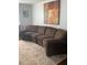 Cozy living room featuring a comfortable brown sofa and patterned rug at 2569 Northview Ave, Decatur, GA 30032