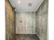 Shower featuring gray, vertical tiling, a shower head, and non-slip flooring at 2569 Northview Ave, Decatur, GA 30032