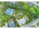 Aerial view of tennis court, playground and undeveloped space near the residence at 3540 Lindsy Brook, Douglasville, GA 30135