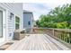 Wooden deck with outdoor seating offers a pleasant spot to unwind and enjoy the view at 3540 Lindsy Brook, Douglasville, GA 30135