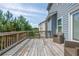 Private outdoor wooden deck with exterior view surrounded by lush trees and greenery at 3540 Lindsy Brook, Douglasville, GA 30135