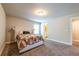 Spacious carpeted bedroom with decorative headboard and natural light; bathroom entrance at 3540 Lindsy Brook, Douglasville, GA 30135