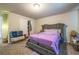 Bedroom with purple bed and gray headboard with a closet, window, and carpeted floor at 3540 Lindsy Brook, Douglasville, GA 30135