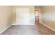 Bedroom with neutral carpet and trim and a view into the upstairs hallway at 3540 Lindsy Brook, Douglasville, GA 30135
