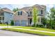 Charming two-story brick home with a two-car garage, and a nicely landscaped front yard at 3540 Lindsy Brook, Douglasville, GA 30135