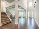 Bright foyer boasts soaring ceilings, wood floors, and staircase at 3540 Lindsy Brook, Douglasville, GA 30135
