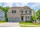 Charming brick two-story home featuring a two-car garage and well-manicured landscaping at 3540 Lindsy Brook, Douglasville, GA 30135