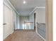 Upstairs hallway with carpet and metal and wood banister at 3540 Lindsy Brook, Douglasville, GA 30135