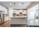 Spacious kitchen with stainless appliances, white cabinetry, granite countertops, and a large island with a sink at 3540 Lindsy Brook, Douglasville, GA 30135