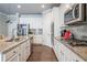 Modern kitchen with stainless steel appliances, granite countertops, tiled backsplash, and center island with sink at 3540 Lindsy Brook, Douglasville, GA 30135