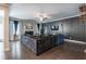 Comfortable living room with fireplace, dark accent wall, and hardwood floors at 3540 Lindsy Brook, Douglasville, GA 30135