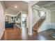 Open-concept living area with hardwood floors and stylish wainscoting at 3540 Lindsy Brook, Douglasville, GA 30135