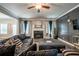 Inviting living room boasts a fireplace, dark accent wall, and ample seating for relaxing and entertaining at 3540 Lindsy Brook, Douglasville, GA 30135