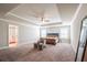 Spacious main bedroom boasts a tray ceiling, ceiling fan and sitting area at 3540 Lindsy Brook, Douglasville, GA 30135