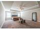 This spacious main bedroom features a tray ceiling, neutral paint, carpet flooring, and a full length mirror at 3540 Lindsy Brook, Douglasville, GA 30135