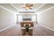A bright main bedroom offers a tray ceiling and a sitting area at 3540 Lindsy Brook, Douglasville, GA 30135