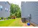 A well-manicured side yard shows professional landscaping with a lawn between houses at 3540 Lindsy Brook, Douglasville, GA 30135