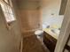 Full bathroom featuring a shower-tub combo and single sink vanity at 1789 Riverridge Nw Dr, Conyers, GA 30012