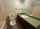 Full bathroom with shower-tub combo with extended vanity and large mirror at 1789 Riverridge Nw Dr, Conyers, GA 30012