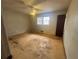 Bedroom features hardwood floors, neutral walls, ceiling fan and window at 1789 Riverridge Nw Dr, Conyers, GA 30012