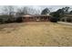 Charming single-story brick home with a well-maintained front yard and traditional design elements at 1789 Riverridge Nw Dr, Conyers, GA 30012