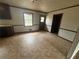 Eat in kitchen space featuring an exterior door, laminate floor and window at 1789 Riverridge Nw Dr, Conyers, GA 30012