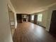 Cozy living room featuring a brick fireplace, built-in bookshelves, and wood flooring at 1789 Riverridge Nw Dr, Conyers, GA 30012