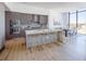 Sleek kitchen with stainless steel appliances, island with seating, and adjacent dining area at 2425 Peachtree Nw Rd # 1802, Atlanta, GA 30305