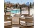 Outdoor pool area with cozy seating around a modern fire pit, ideal for relaxing and socializing at 2425 Peachtree Nw Rd # 1802, Atlanta, GA 30305