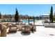 Relaxing pool area with comfortable seating, lush landscaping, and stunning city views at 2425 Peachtree Nw Rd # 1802, Atlanta, GA 30305