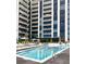Stunning rooftop pool surrounded by modern high-rise buildings and comfortable lounge chairs at 2425 Peachtree Nw Rd # 1802, Atlanta, GA 30305