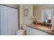 Well-maintained bathroom with vanity, granite counters, and a shower-tub combo, great for everyday use at 8440 Woodland Brooke Trl, Cumming, GA 30028