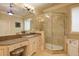 Bright bathroom featuring granite countertops, custom cabinets, and a glass enclosed walk-in shower at 8440 Woodland Brooke Trl, Cumming, GA 30028