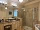 Bathroom features granite counters, double sinks, framed mirrors, soaking tub and large walk-in shower at 8440 Woodland Brooke Trl, Cumming, GA 30028
