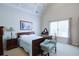 Bright bedroom featuring a vaulted ceiling, neutral walls, and a window allowing ample natural light at 8440 Woodland Brooke Trl, Cumming, GA 30028