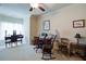 Comfortable, carpeted bedroom with ceiling fan and natural light from the windows at 8440 Woodland Brooke Trl, Cumming, GA 30028