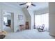 Large bedroom with carpet and natural light, leads to other rooms in the home at 8440 Woodland Brooke Trl, Cumming, GA 30028