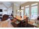 Bright dining room with views to the exterior at 8440 Woodland Brooke Trl, Cumming, GA 30028