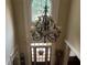 Grand foyer with a chandelier and a view of the front door at 8440 Woodland Brooke Trl, Cumming, GA 30028