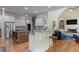 Open kitchen with stainless appliances and island at 8440 Woodland Brooke Trl, Cumming, GA 30028