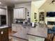 Bright kitchen featuring granite countertops, stainless steel appliances and an open floor plan at 8440 Woodland Brooke Trl, Cumming, GA 30028