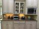 Kitchen featuring custom cabinetry, granite countertops, and stainless steel appliances for a modern look at 8440 Woodland Brooke Trl, Cumming, GA 30028