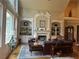 Spacious living room featuring a fireplace and built-in shelving, perfect for relaxing or entertaining guests at 8440 Woodland Brooke Trl, Cumming, GA 30028