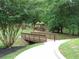 Playground nestled in nature offering an engaging and scenic outdoor activity area at 8440 Woodland Brooke Trl, Cumming, GA 30028